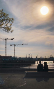Break, two people at the port of Hamburg, Germany Break, two people at the port of Hamburg, Germany
